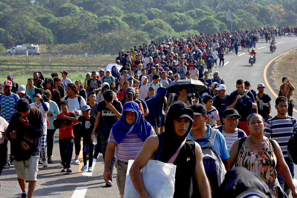 Migrants walk in a caravan in Huixtla, Mexico, Jan. 26, 2024, toward the U.S. border. U.S. senators Feb. 4 unveiled a deal on border enforcement paired with security assistance for Ukraine, Israel and Indo-Pacific countries. (OSV News/Reuters/Jose Torres)