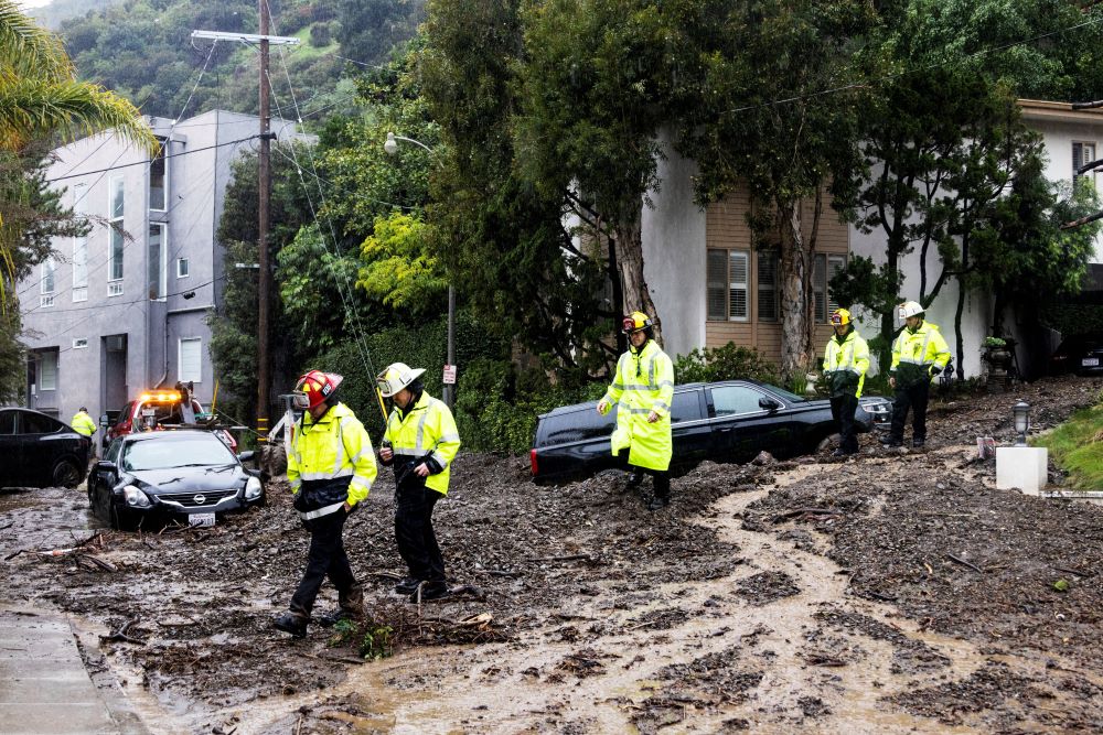 First responders inspect a mudslide in Studio City, Calif., Feb. 5, 2024, following heavy rains and flooding. One of the wettest storms in Southern California history unleashed at least 475 mudslides in the Los Angeles area after dumping more than half the amount of rainfall the city typically gets in a season in just two days, and officials warned Feb. 6 that the threat was not over yet. (OSV News photo/Aude Guerrucci, Reuters)