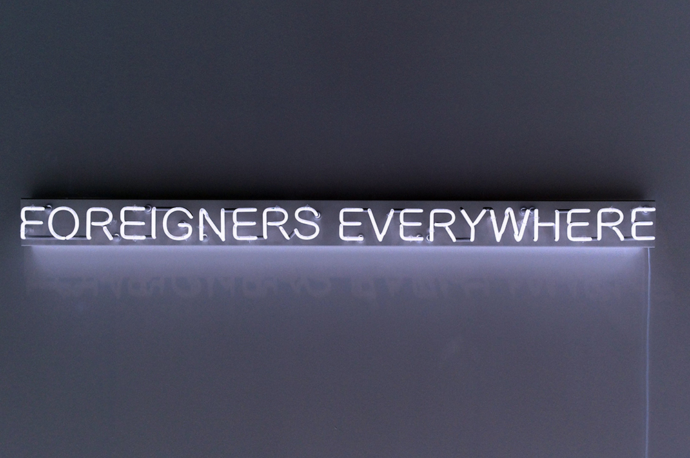 A neon installation spelling "Foreigners Everywhere," is seen in this photograph taken at the Galerie Neu in Berlin, Germany, in 2014. The art piece was created by the Italian-British artist collective, Claire Fontaine, and it will be exhibited at the 60th Venice Biennale in Venice, Italy, to illustrate the international contemporary art exhibition's theme this year: "Stranieri Ovunque — Foreigners Everywhere." (CNS/Courtesy of Studio Claire Fontaine)