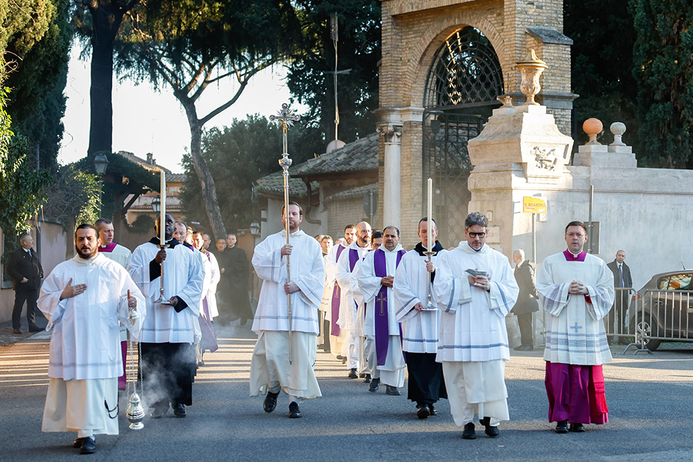 Altar servers lead the procession from the Church of St. Anselm to the Basilica of Santa Sabina in Rome for the celebration of Ash Wednesday Mass with Pope Francis Feb. 14, 2024. (CNS/Lola Gomez)