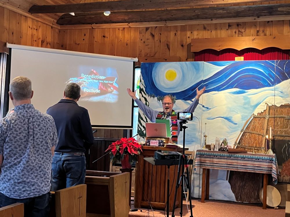 Pastor Jonathan Mays talks to his congregation at Greensky Hill Indian United Methodist Church in Charlevoix, Michigan. The church is putting solar panels on its meeting hall next door. Grist / Izzy Ross