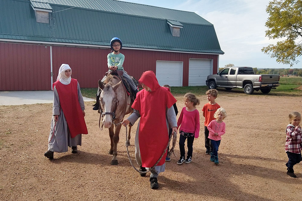 Connecting with animals and spending time with the women of the Franciscan Association of Divine Mercy is just part of the ministry offered to children and adults who visit the Merciful Heart of Jesus Farm. Foundress Mother Mary Veronica Fitch and Sr. Maria Lucia Schnaufer also work with guests and visitors to build a more profound faith life. (Courtesy of Mary Veronica Fitch)