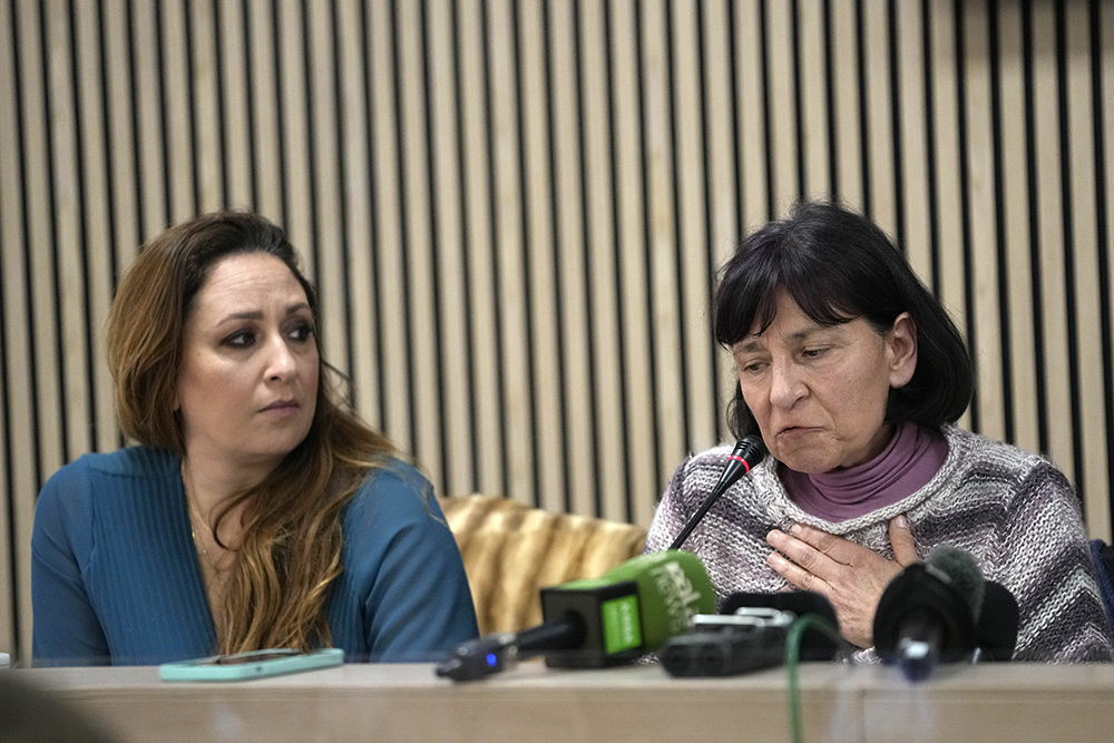 Lawyer Laura Sgro, left, listens to Gloria Branciani during a press conference in Rome Feb. 21, 2024. Gloria Branciani, 59, is one of the first women who accused Fr. Marko Rupnik, a once-exalted Jesuit artist of spiritual, psychological and sexual abuse. (AP/Alessandra Tarantino)