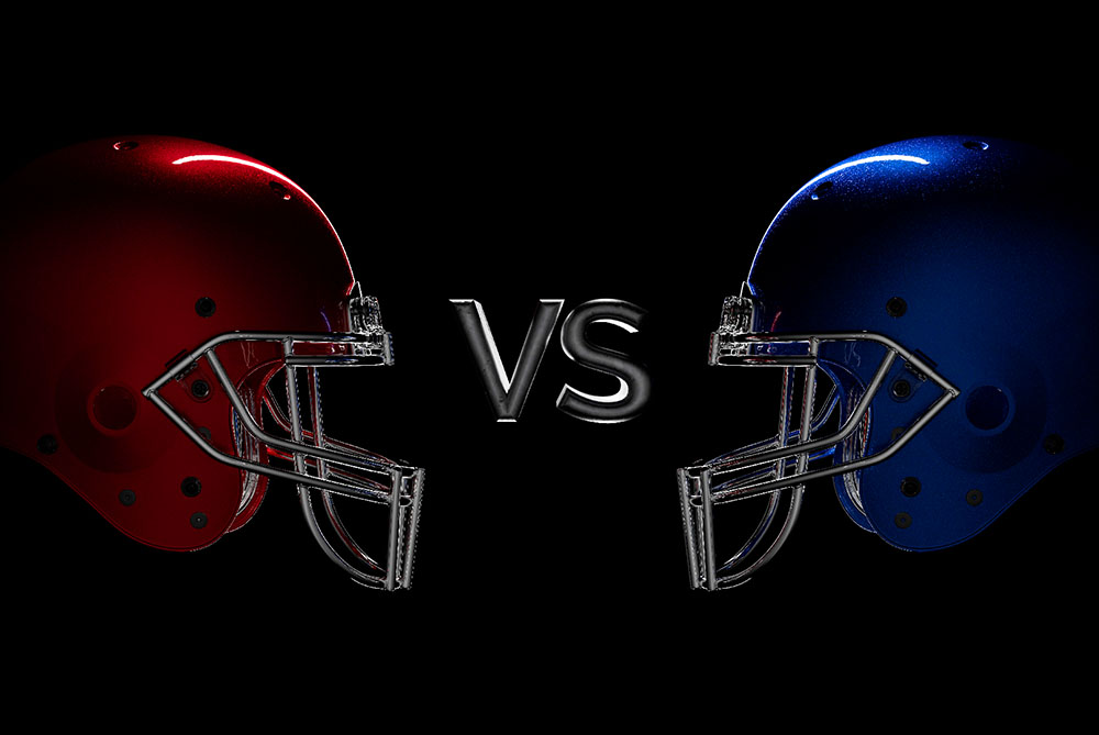 Red football helmet vs. blue football helmet (Dreamstime/Swatchandsoda)