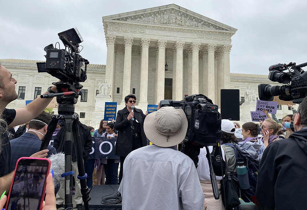 Jamie Manson of Catholics for Choice speaks to a crowd outside the U.S. Supreme Court May 3, 2022, the day after a draft opinion was leaked signaling that the majority of justices were leaning toward overturning Roe v. Wade. (CNS/Rhina Guidos)