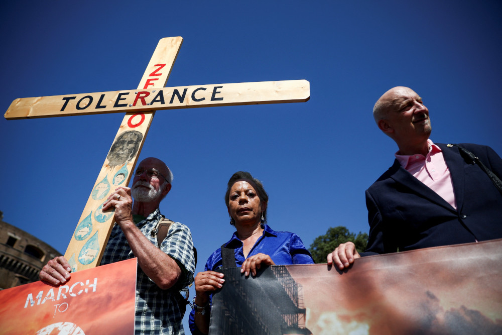 Advocates for zero tolerence of clergy sexual abuse including Tim Law, left, Denise Buchanan and Peter Isely attend a march with survivors of clergy sexual abuse and activists near the Vatican in Rome Sept. 27, 2023. (OSV News photo/Guglielmo Mangiapane, Reuters)