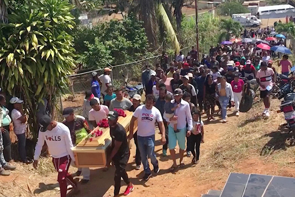 People carry a casket of a miner during his funeral in La Paragua, Bolivar, Venezuela, Feb. 22, 2024, who died when an illegal gold mine collapsed. Miners are still being evacuated from Venezuelan gold mine that collapsed Feb. 20, as church leaders call for more support for Indigenous people. (OSV News screenshot/Reuters TV)