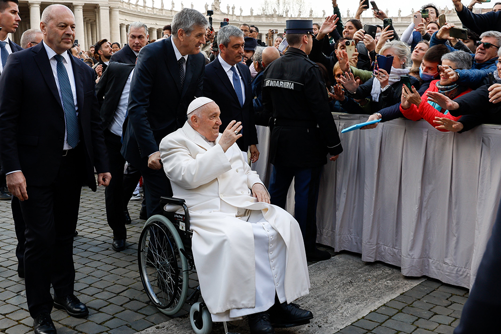 Pope Francis greets visitors after his weekly general audience in St. Peter's Square at the Vatican March 6, 2024. (CNS/Lola Gomez)