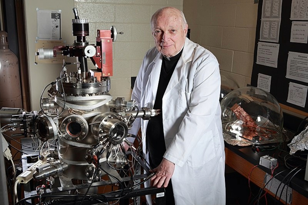 Haig in lab Portrait of Jesuit Fr. Frank Haig in laboratory.