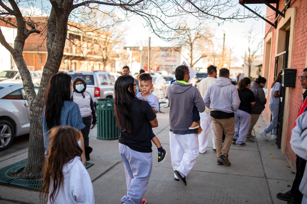 A family of migrants is dropped off by a transport contractor for the U.S. Customs and Border Protection at a shelter run by Annunciation House in downtown El Paso, Texas, Dec. 13, 2022.