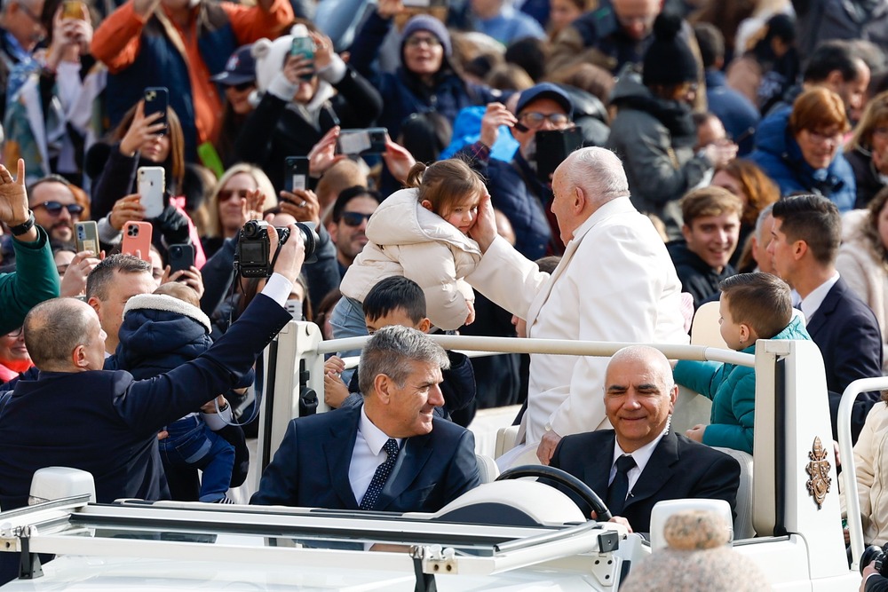 Pope Francis general audience Pope Francis greets child during general audience.