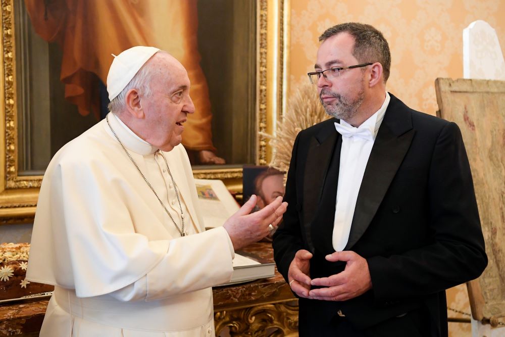 Pope Francis speaks with Andrii Yurash, Ukraine's ambassador to the Holy See, during a meeting for the ambassador to present his credentials to the pope at the Vatican in this April 7, 2022, file photo.