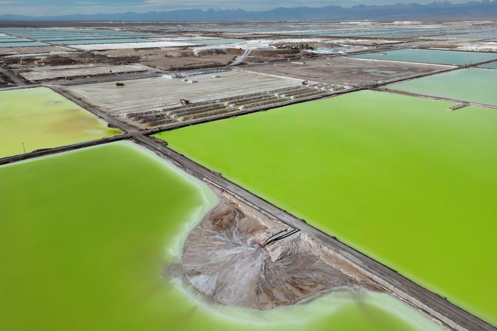 Brine evaporates in pools at the lithium extraction plant facilities of the SQM Lithium company near Peine, Chile, on April 18, 2023.