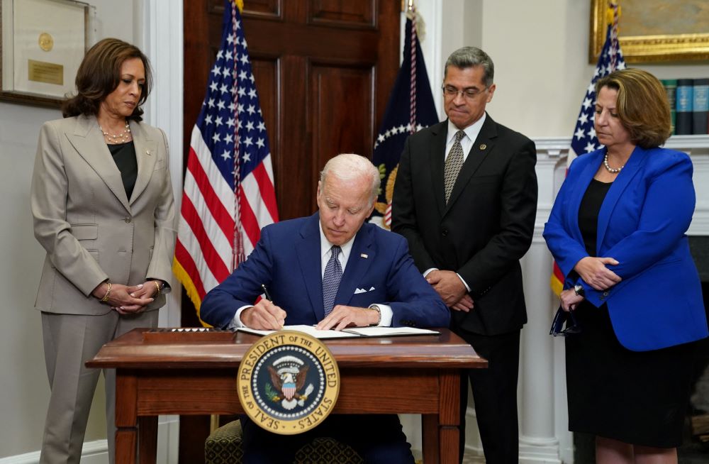 President Joe Biden signs an executive order at the White House in Washington July 8, 2022, that he said would help safeguard women's access to abortion and contraceptives.