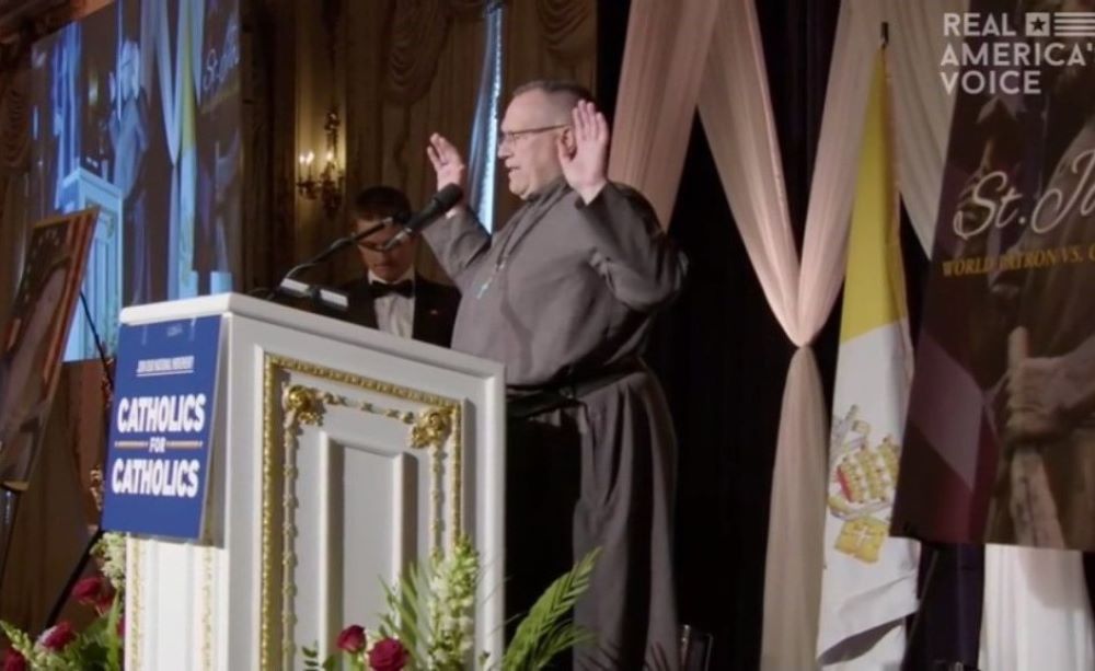 At the March 19 "Catholic Prayer for Trump" at Mar-a-Lago, a man identified as "Father Dennis" prayed for attendees and the Trump family, and blessed the meal.