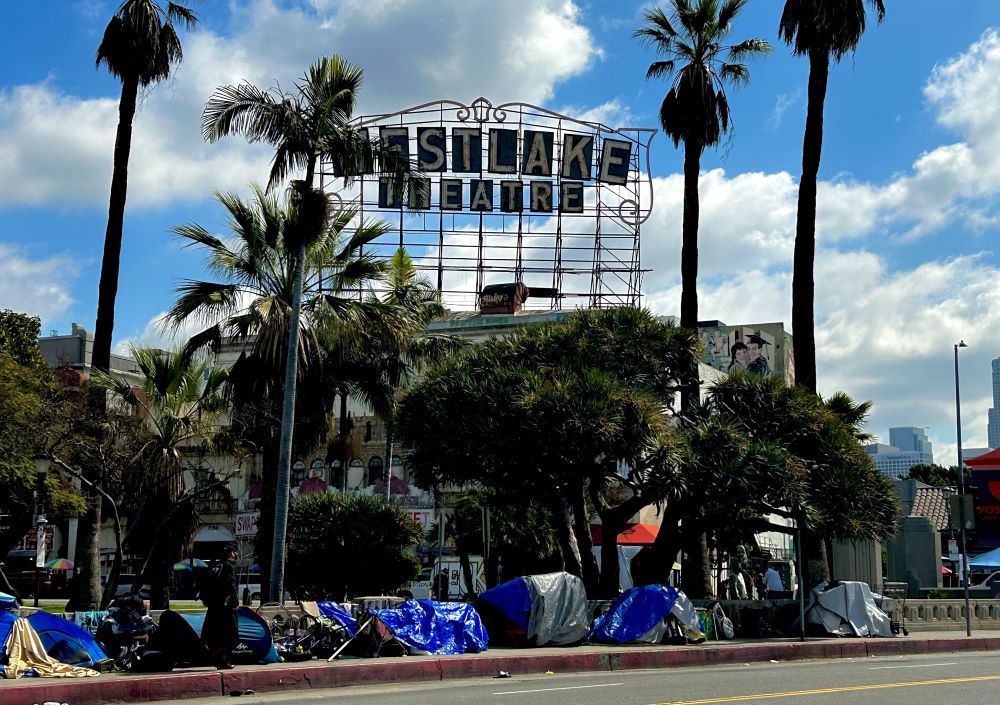 Makeshift tarps and shelters line the street near MacArthur Park.