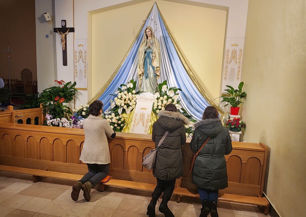 Pilgrims to the Marian shrine in Medjugorje, Bosnia and Herzegovina, pray at the Church of St.  James. 