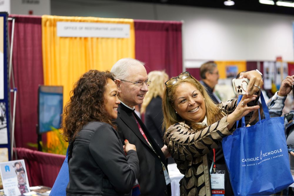 Attendees take a selfie with Los Angeles Archbishop José Gomez Feb. 16 during the 68th Los Angeles Religious Education Congress at the Anaheim Convention Center.