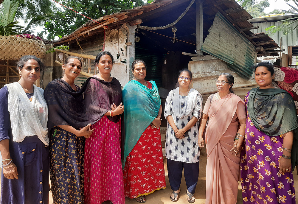 Sr. Stella Baltazar, former Ooty provincial of the Franciscan Missionaries of Mary (second from right) in her habit, and Sr. Anita Edwin, (third from right) with Kovai Meera (third from left) in front of the rented residence for trans women on the outskirts of Coimbatore, a major town in the southern Indian state of Tamil Nadu. (Saji Thomas)