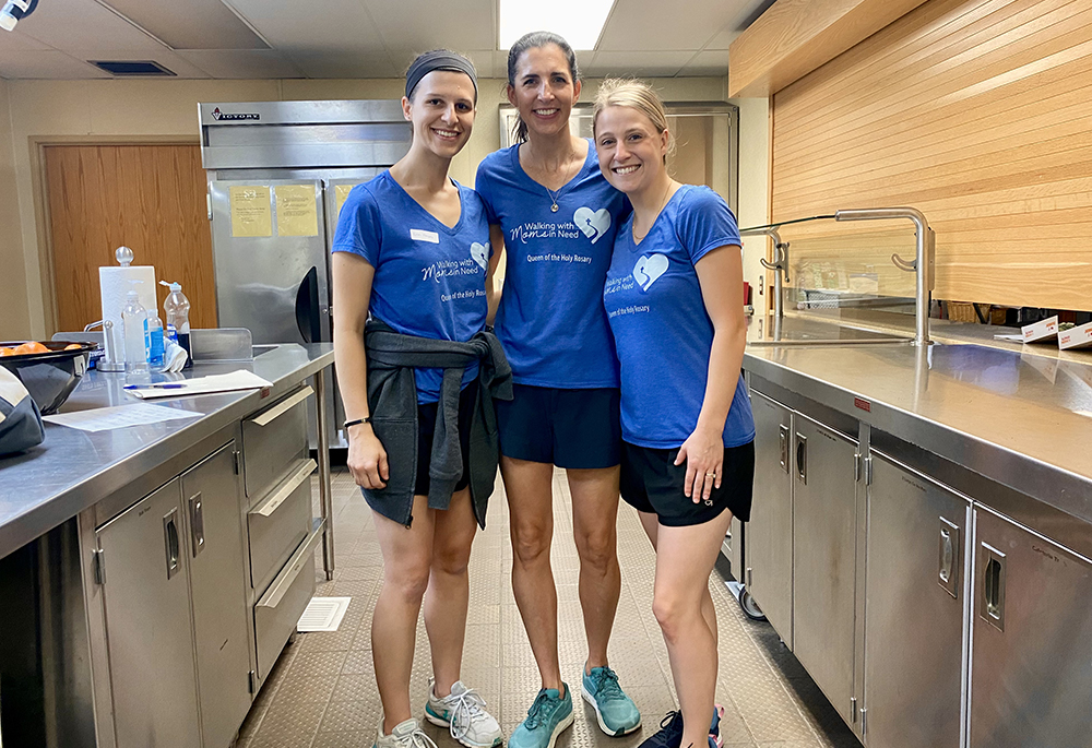 Katie O’Hara, center, volunteer coordinator, and other volunteers from the Walking with Moms in Need group at Queen of the Holy Rosary Parish in Overland Park, Kansas, clean up after the awareness walk in October 2023. (Courtesy of Katie O'Hara)