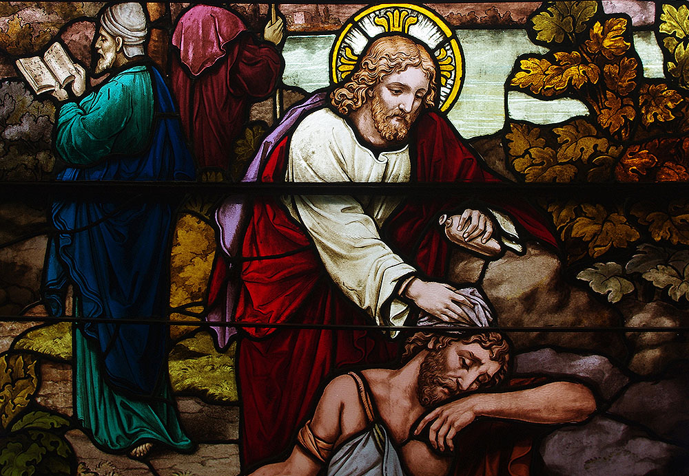 A stained glass window at St. Henry Catholic Church in St. Henry, Ohio, depicts Christ as the good Samaritan. (Wikimedia Commons/Nheyob)
