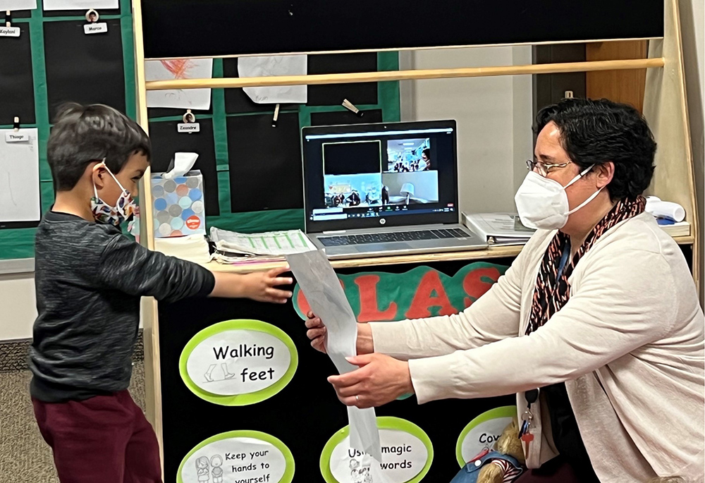 Sr. Veronica Fajardo works with a child at Holy Cross Ministries' School Readiness Program in Park City, Utah. (Courtesy of Holy Cross Ministries)