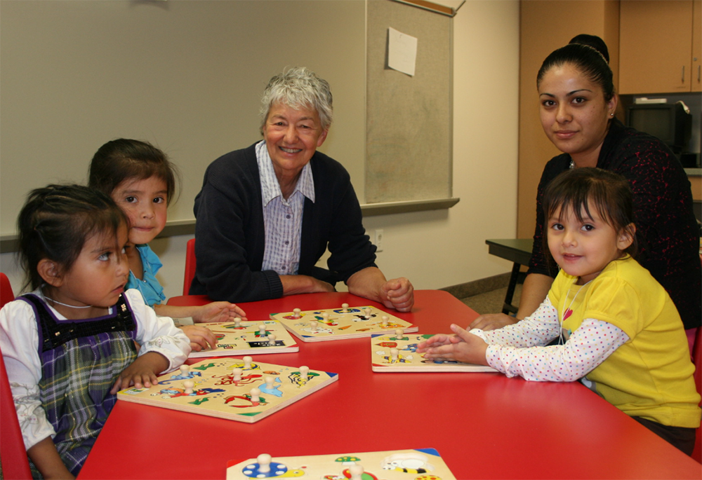 Sr. Mary Ann Pajakowski teaches preschool children at the School Readiness Program operated by Holy Cross Ministries in Park City, Utah. (Courtesy of Holy Cross Ministries)