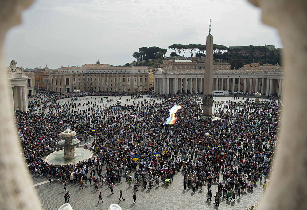 A rainbow peace flag is seen in St. Peter's Square as Pope Francis leads the Angelus from the window of his studio overlooking the square March 27, 2022, at the Vatican. (CNS/Vatican Media)