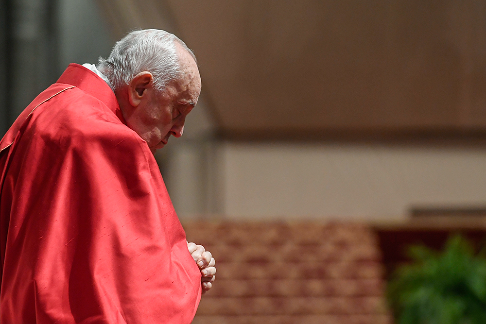 Pope Francis prays during the Good Friday Liturgy of the Lord's Passion in St. Peter's Basilica at the Vatican March 29. (CNS/Vatican Media)