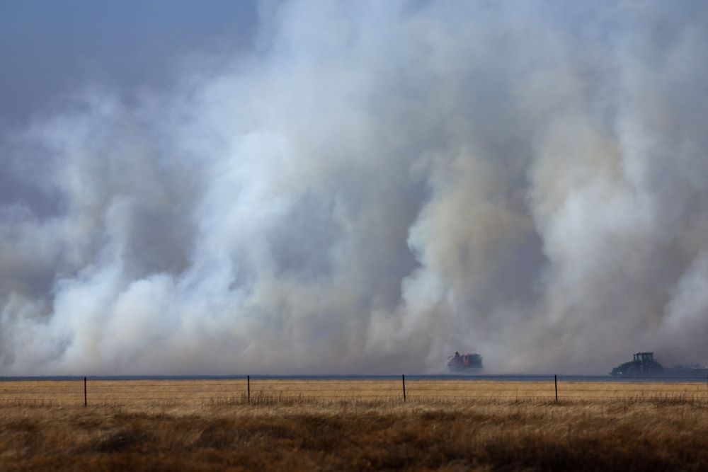 Local firefighters work to contain a wildfire after it was whipped up by high winds in Pampa, Texas on March 2. (OSV News/Reuters/Leah Millis)
