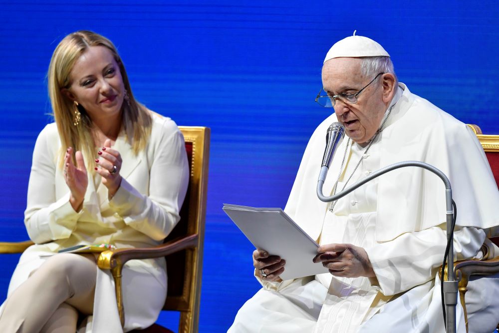 Italian Prime Minister Giorgia Meloni applauds Pope Francis during a meeting about families and Italy's declining birthrate May 12, 2023, in Rome.