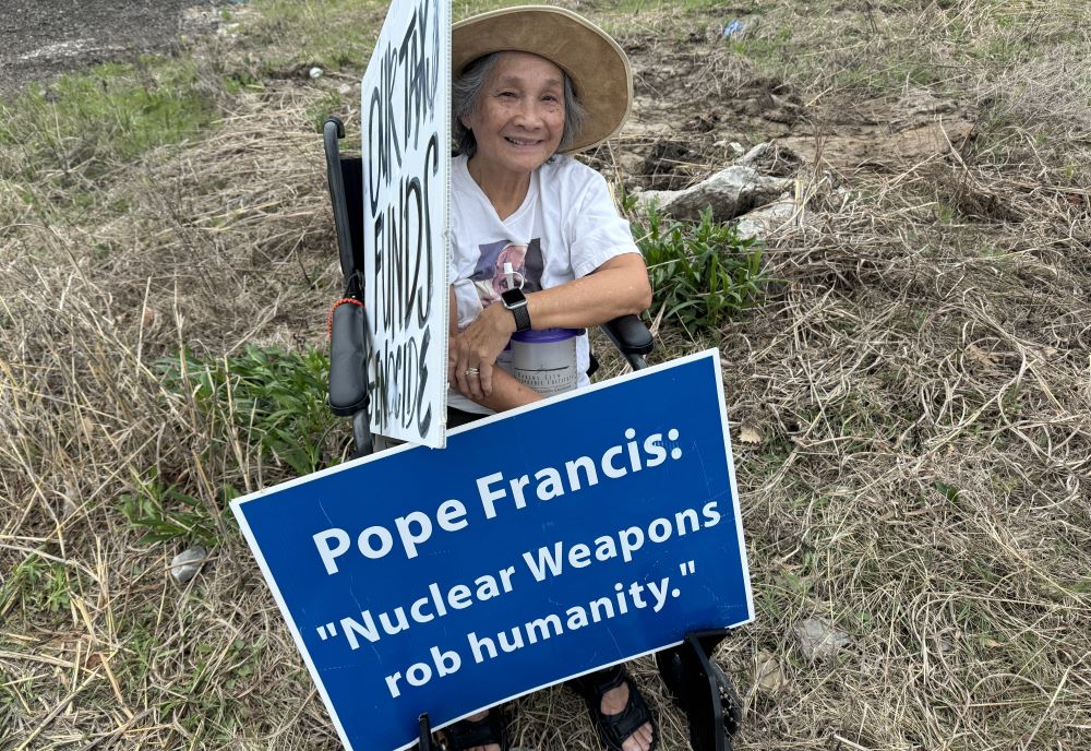 Hoa Fox protests nuclear weapons outside a plant run by Honeywell in Kansas City, Missouri, April 15.