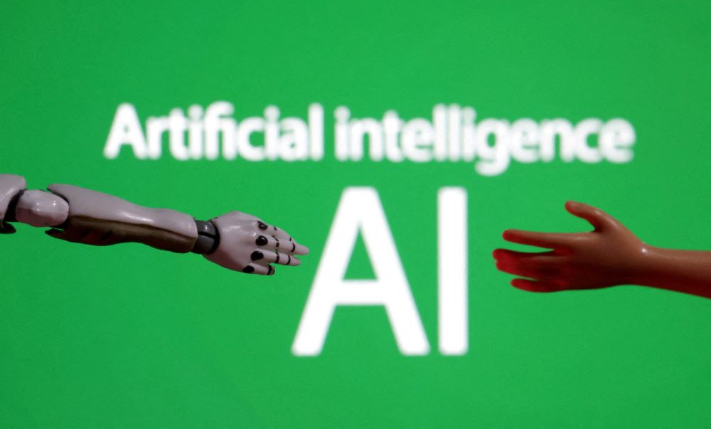 Robotic hands reach toward words "artificial intelligence."