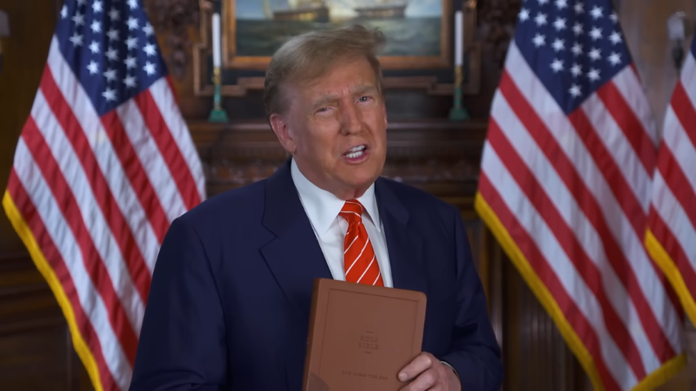 Former President Donald J. Trump, the presumptive Republican presidential nominee, is pictured in a screenshot from a video pitching sales of his $60 "God Bless the USA Bible" during Holy Week, in partnership with country singer Lee Greenwood.