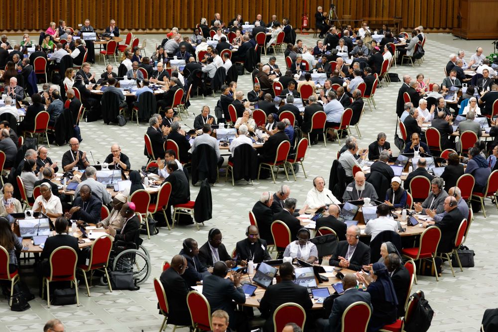 Members of the assembly of the Synod of Bishops start a working session in the Vatican's Paul VI Audience Hall Oct. 18. 