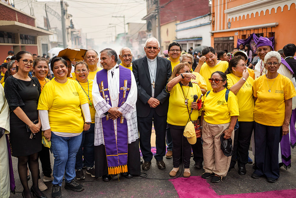 Cardinal Álvaro Ramazzini, center, and Catholic volunteers wait for the arrival of a religious procession in Guatemala City March 23. (AP/Moises Castillo)