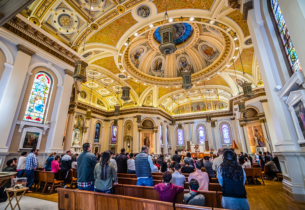 People attend Mass at the Basilica of St. Joseph in San Jose, California, in 2018. According to a new survey, three-quarters of U.S. Catholics view Pope Francis favorably, but that figure is down 8 percentage points from 2021. (Dreamstime/Andreistanescu)