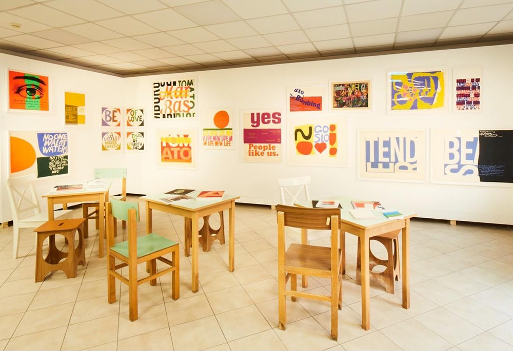 The artwork of Corita Kent is part of the Vatican's Biennale pavilion, located within the Giudecca women's detention center in Venice. The exhibition "With My Eyes" utilizes the prison's chapel, cafeteria and corridors to display about ten artists' works. (Courtesy of Marco Cremascoli, 2024)