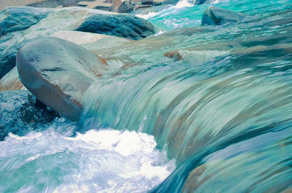 Water flowing over rocks (Unsplash/Leo Rivas)