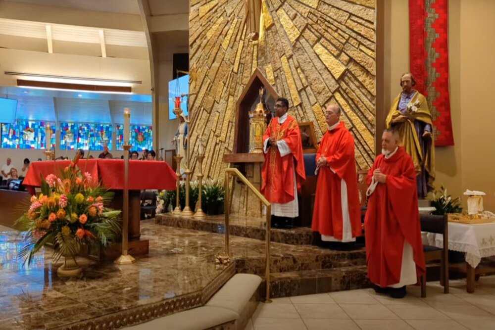 Florida priest bites woman Priest, vested, stands before altar