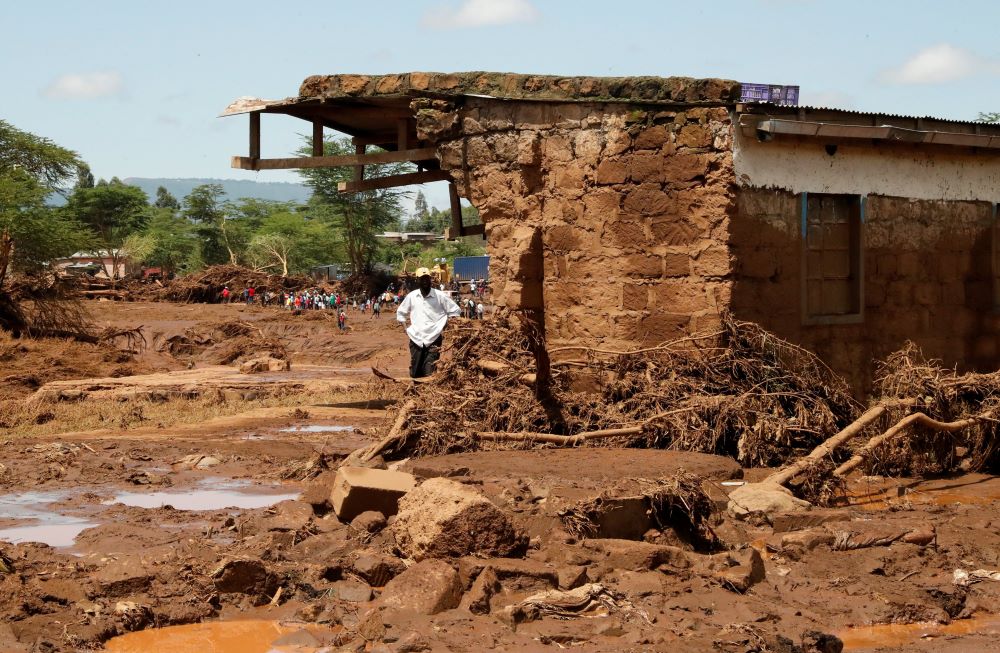 A man looks at the ruins of a house in the Kamuchiri village of Mai Mahiu in central Kenya's Nakuru County April 29.