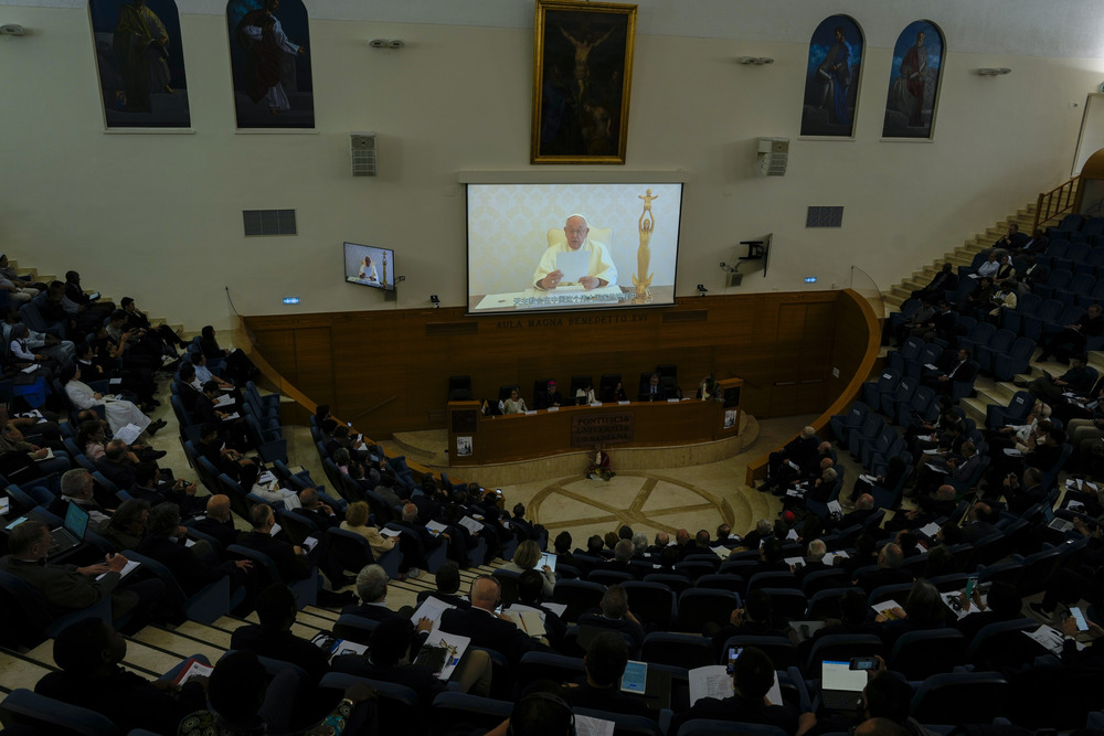 Vatican-China, '100 years since the Concilium Sinense: between history and the present', Rome. Pope Francis seen on screen in front of large seated assembly.