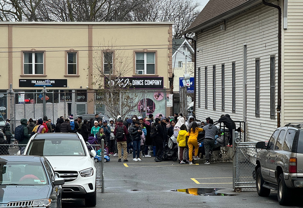 Fr. Dwayne Davis established the Matthew 25 Ministry at St. Thomas Aquinas to provide clothing and other needs to migrants. Once a week migrants take the city bus to the church, seeking out needed items. (Courtesy of St. Thomas Aquinas Church)