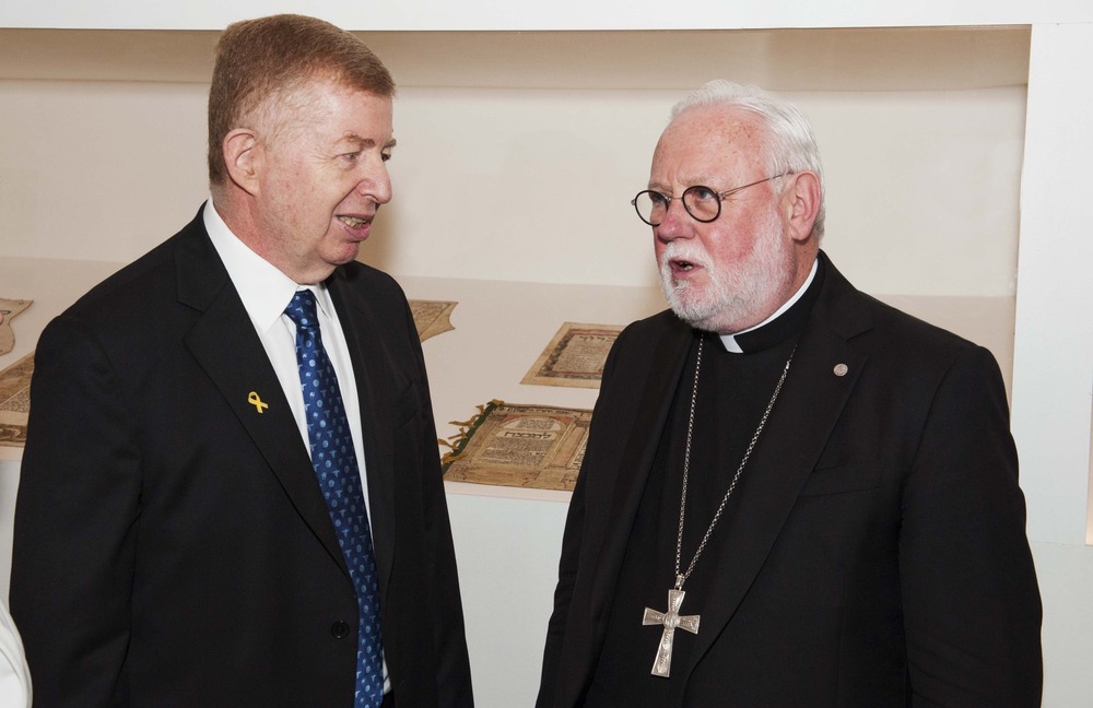 Vatican-Israeli tensions The two men stand facing each other, talking in front of a museum display case