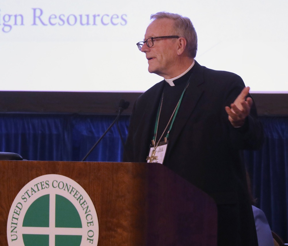 Bishop Robert E. Barron Bishop Barron stands at lectern.