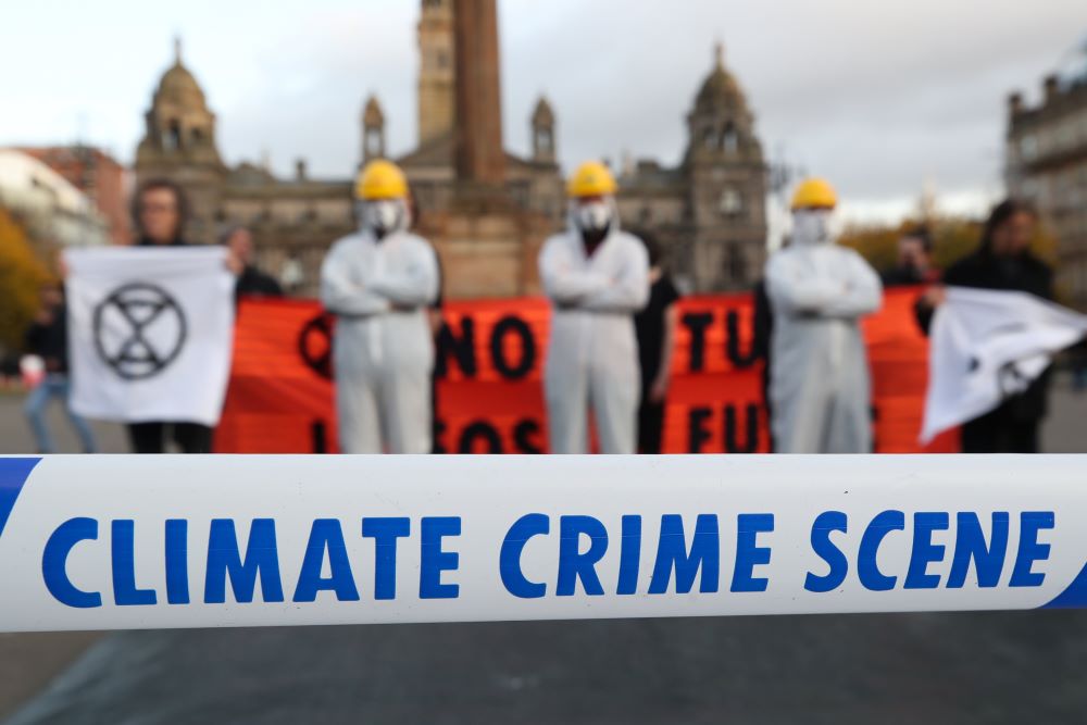 Protesters attend a demonstration against the fossil fuel industry Nov. 7, 2021, during the U.N. Climate Change Conference. known as COP26, in Glasgow, Scotland.