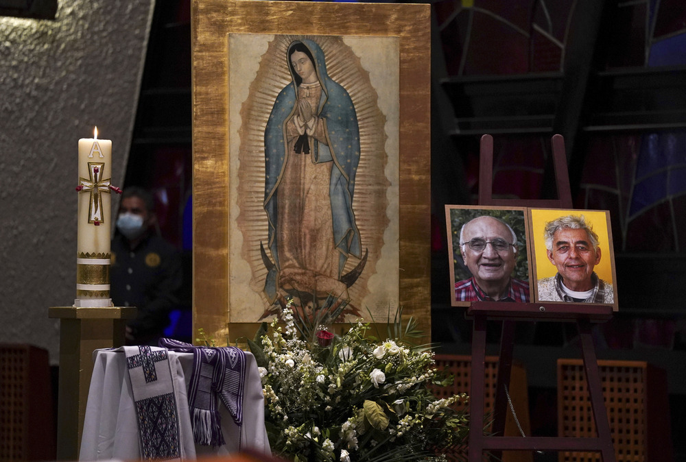 Mexico murdered priests anniversary Framed photographs rest on altar before image of Our Lady of Guadalupe