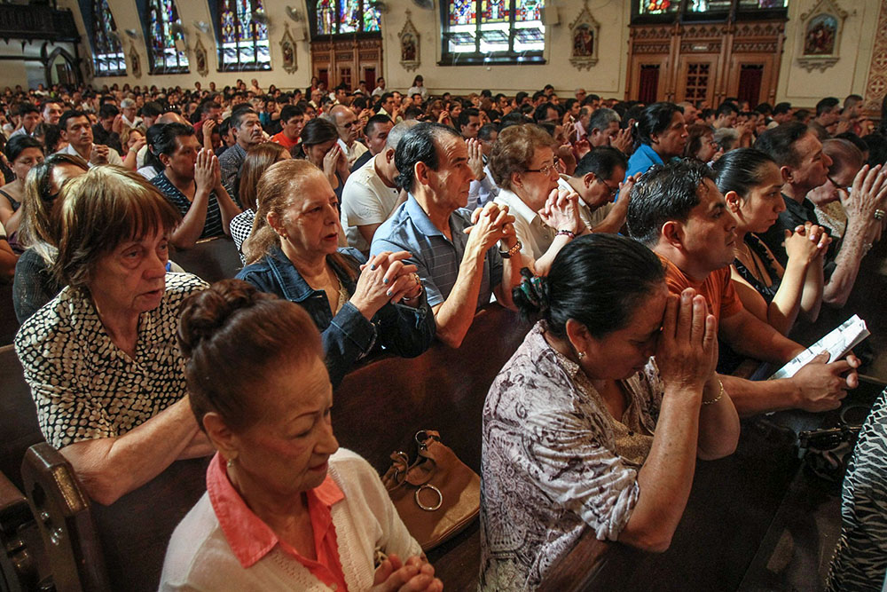 People pray during a Mass at Our Lady of Sorrows Church in the Corona neighborhood of the New York borough of Queens. (OSV News/CNS file/Gregory A. Shemitz)