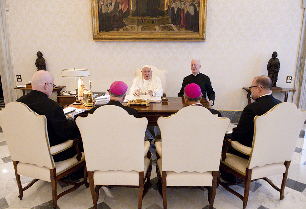 Pope Francis holds his spring meeting with the officers of the U.S. bishops' conference April 18 at the Vatican. Seated from left are: Fr. Paul B.R. Hartmann, associate general secretary; Archbishop Timothy Broglio, president and head of the U.S. Archdiocese for the Military Services; Archbishop William Lori of Baltimore, vice president; and Fr. Michael J.K. Fuller, general secretary. (CNS/Vatican Media)