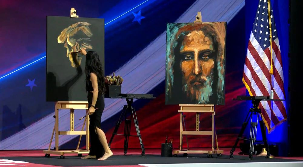 An artist on stage painted an image of former president Donald Trump and an image of the face of Christ, before the Conservative Political Action Conference's annual Ronald Reagan Dinner, Feb. 23.